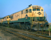 Color three-quarter-angle photo of three road-switcher diesel locomotives
