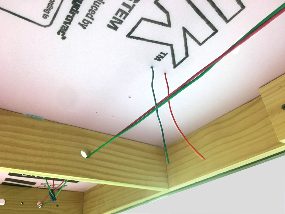Pair of feeder wires seen dangling below layout