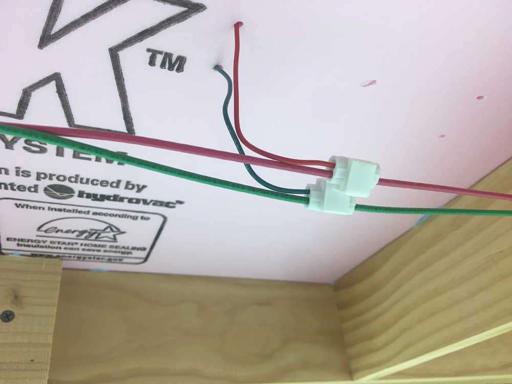 Pair of wires connected to feeder wires with a tap connector