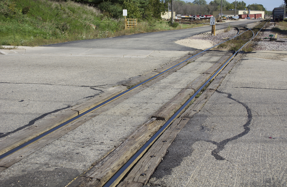 Asphalt-and-timber crossing on west edge of Wisconsin & Southern yard in Horicon, Wis.