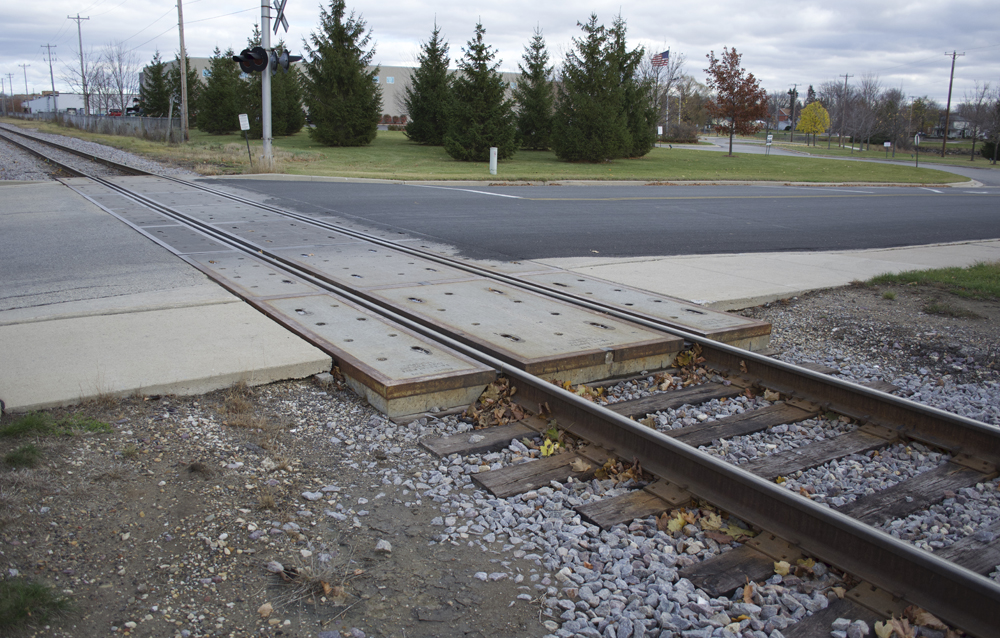 Concrete crossing panels spanning a street and sidewalk in Hartford, Wis.