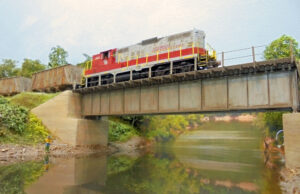 Model diesel locomotive on a bridge