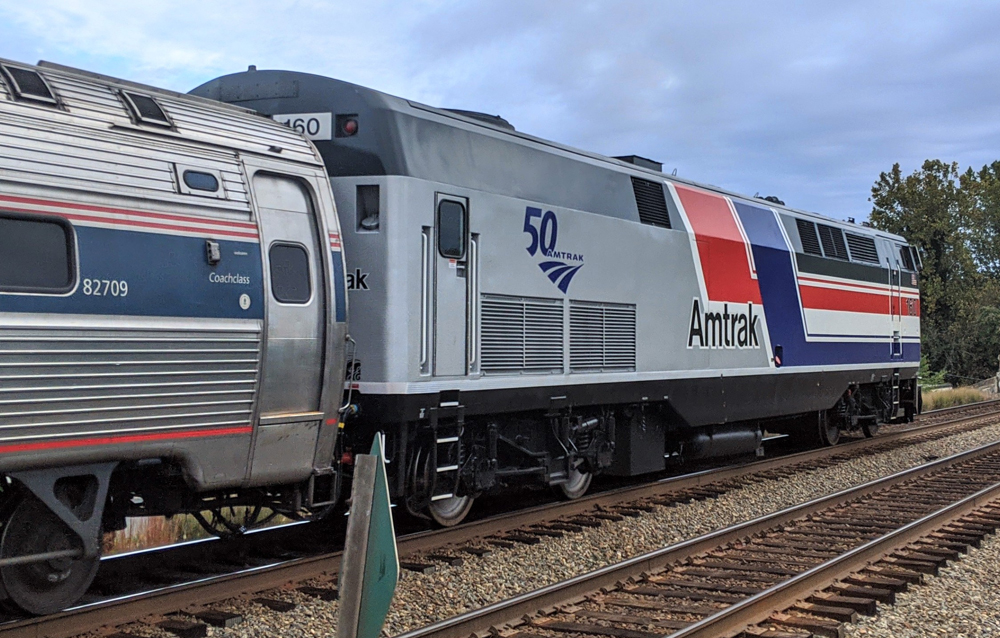 Rear view of locomotive with red, white, and blue stripes