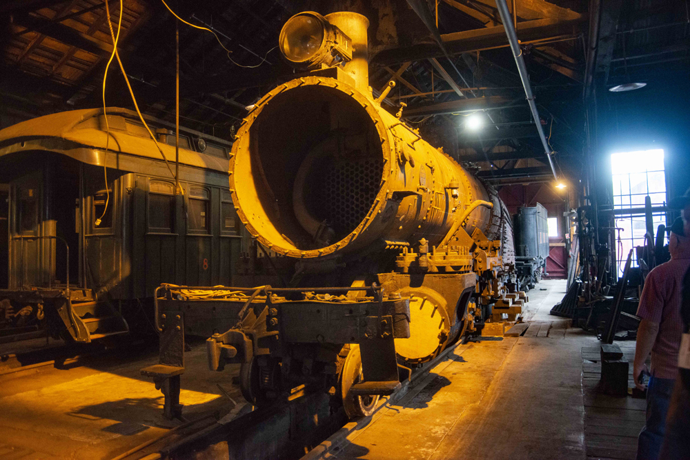 Partially disassembled locomotive inside building