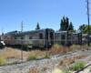 Passenger cars in a grass-covered field.