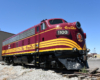 A maroon and yellow-striped cab unit.