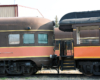 Tails of two observation cars coupled together.