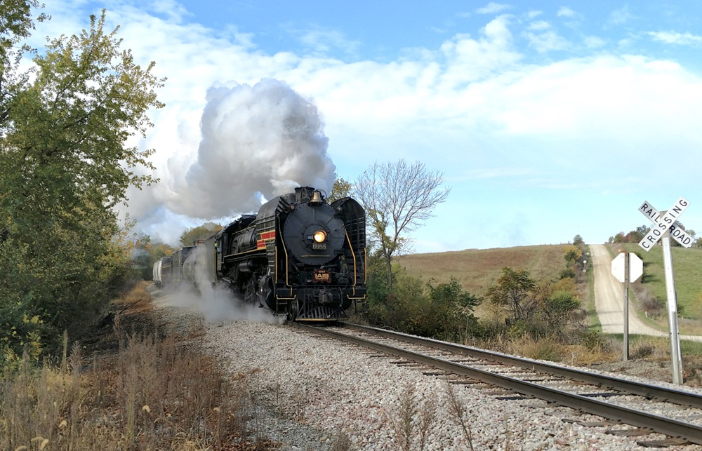 Steam locomotive approaching grade crossing