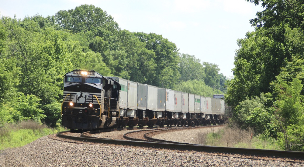 Intermodal train with black locomotives