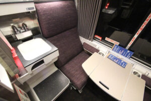 Interior of roomette on Viewliner II sleeper, showing sink next to seat