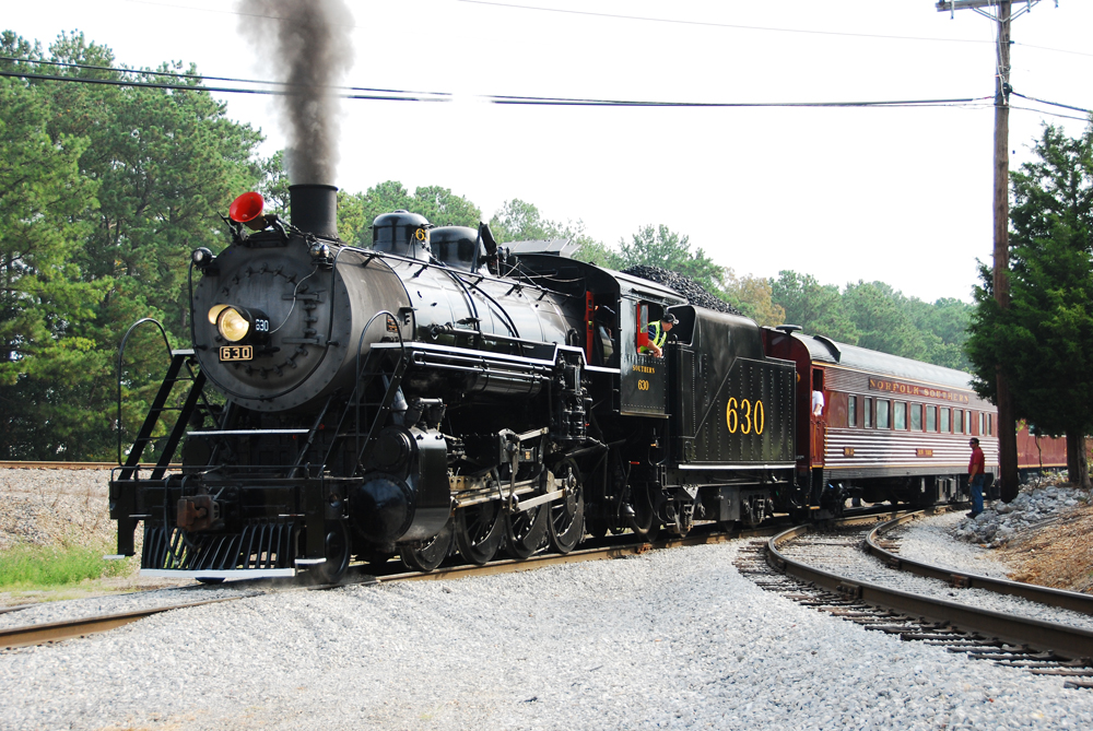 Steam engine pulling passenger train