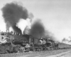 Doubleheaded steam locomotives on passenger train