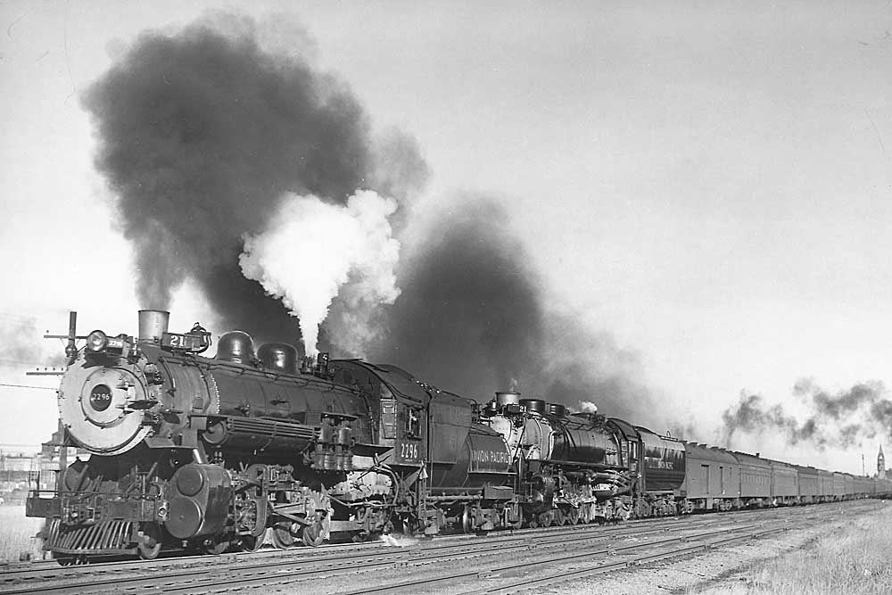 Doubleheaded steam locomotives on passenger train
