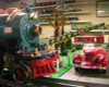 Close up of model Christmas steam engine on layout