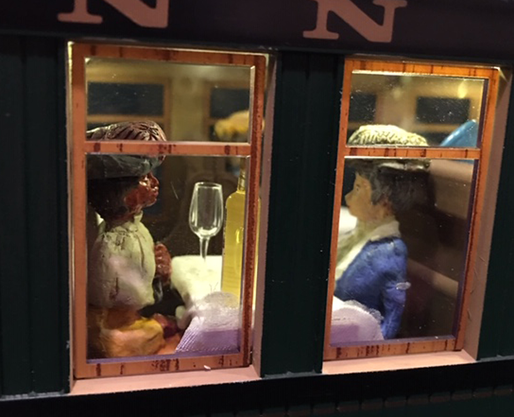 Model figures in a dining car