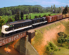 : A black-and-white F unit and a matching Geep pull a manifest freight onto a plate girder bridge