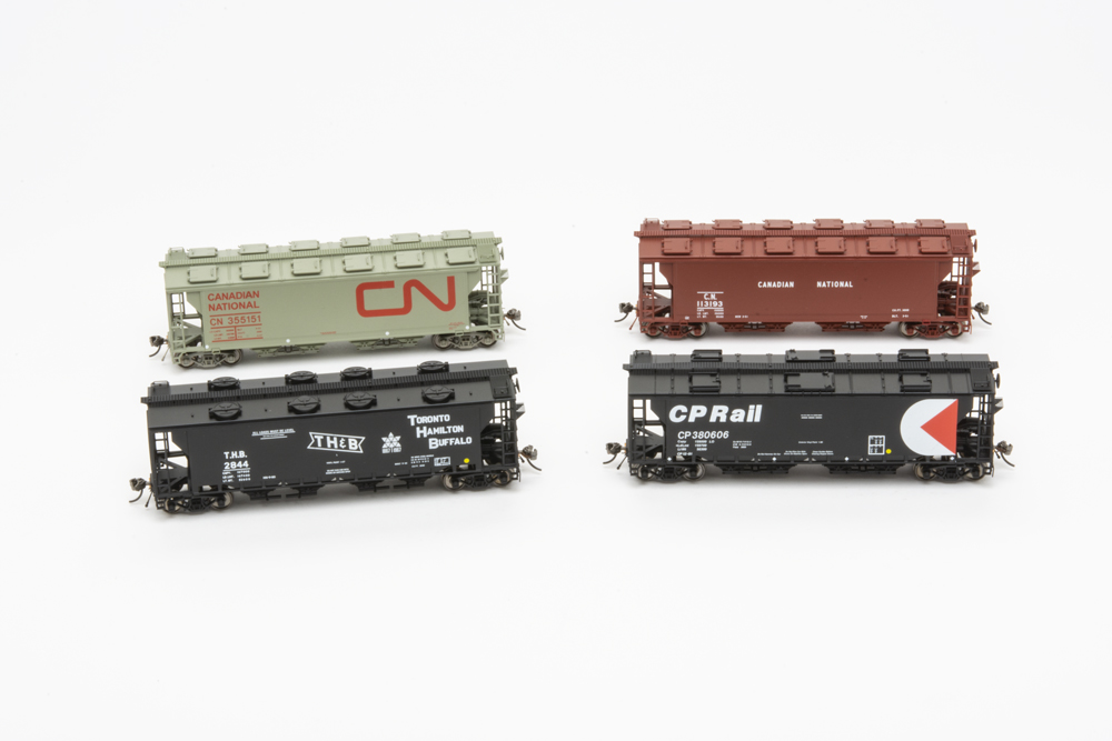Slab-side covered hopper in varying paint schemes.