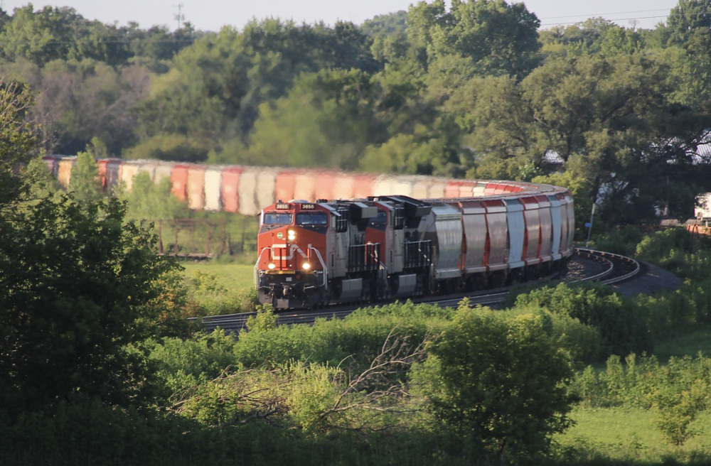 Train of hopper cars rounds curve