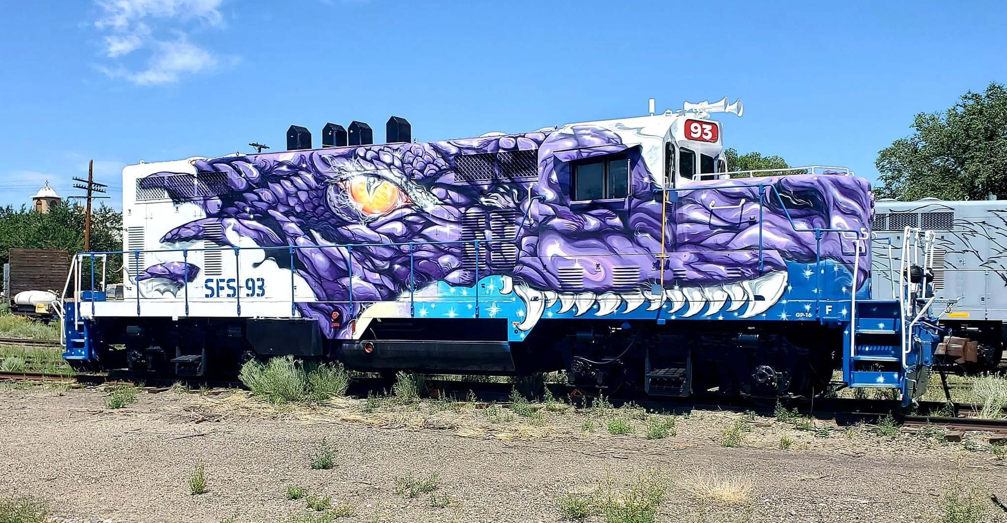 Locomotive with elaborate purple dragon paint scheme