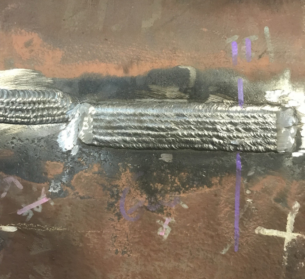 Close-up of new weld on old metal