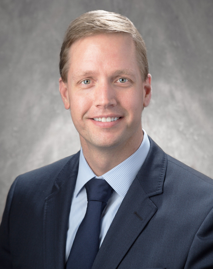 Blonde man in dark suit