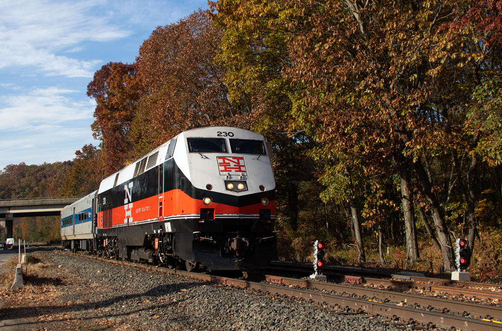 Locomotive and single car pass signals on ground