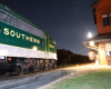 Streamlined passenger diesel at railway depot at night 