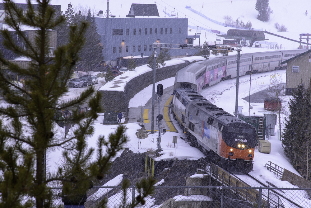 Passenger train on curve in snow