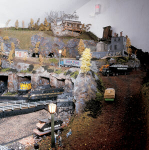 Locomotive emerging from a tunnel on model train layout