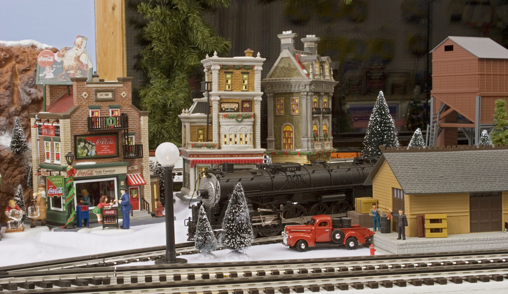 Model steam locomotive in holiday scene