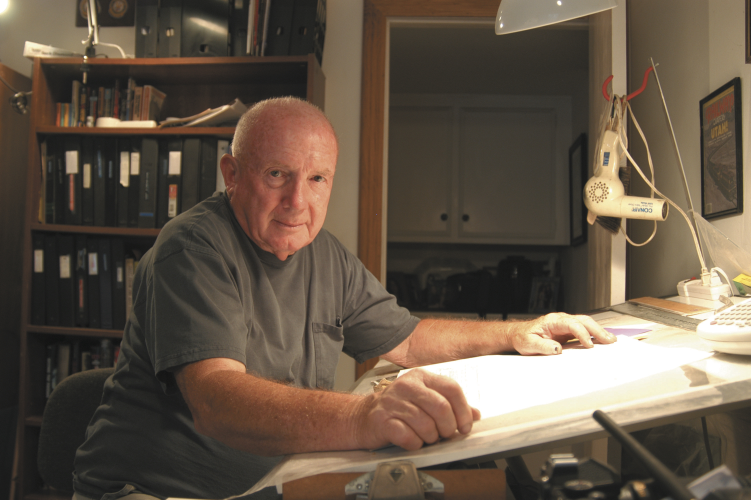 Man sitting at table in home office