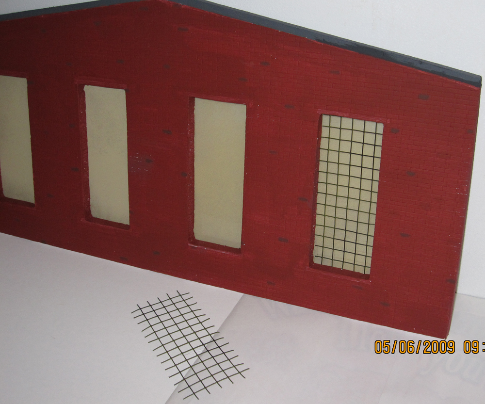 Side of a model engine house with windows