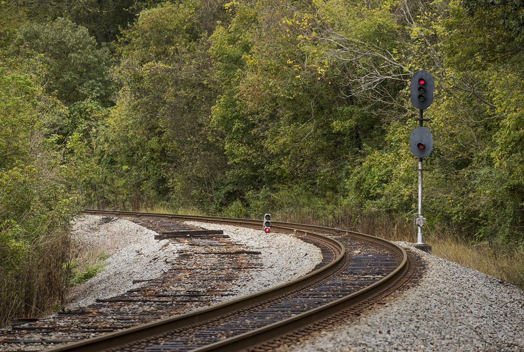 Rail line at curve with only ties remaining from a removed siding.