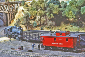 Model Climax locomotive near trestle