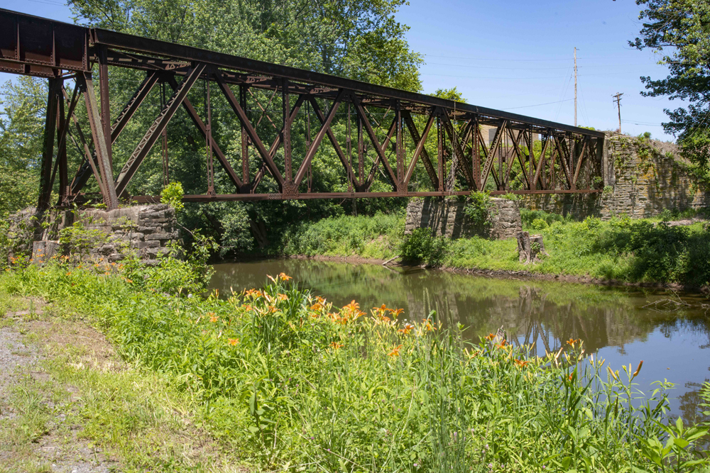 Rusted metal bridge over water