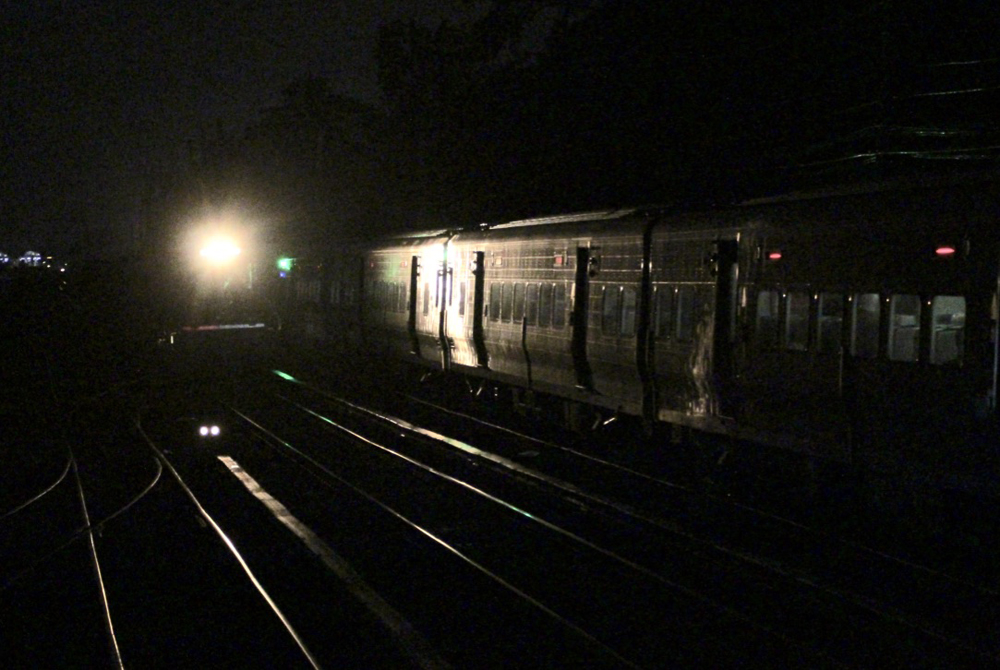 Commuter train and headlight of approach frieght