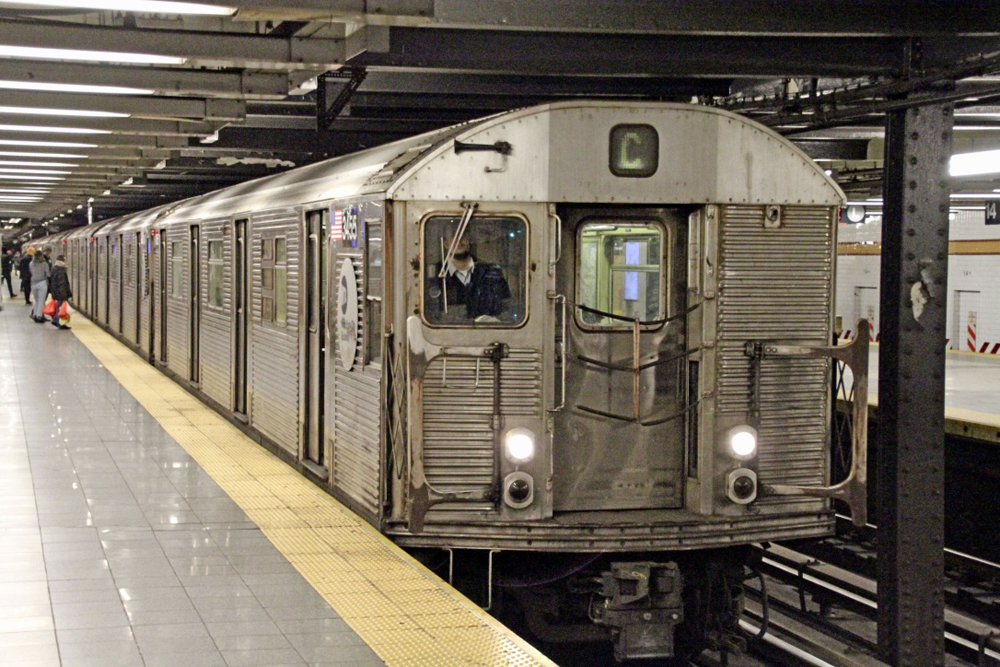 Stainless steel subway train in station