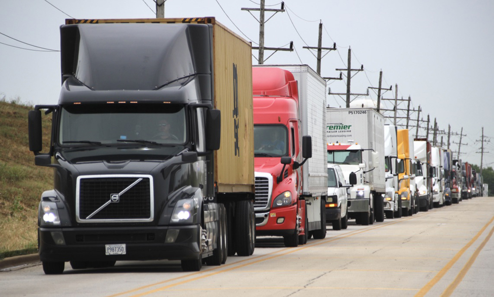 Trucks bumper to bumper on street