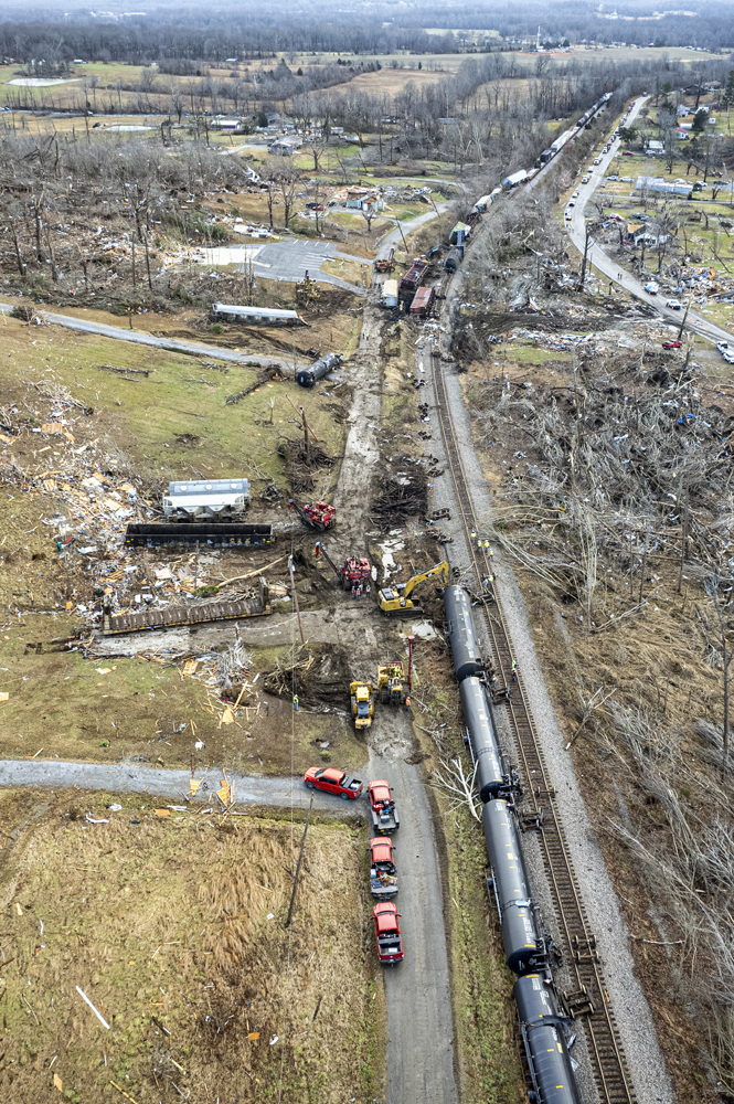 Aerial view showing cars some distance from tracks after derailment