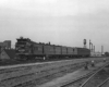 Motorcar with baggage car and coach on multi-track main line