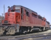 Red and black diesel locomotives parked on curve