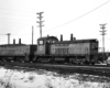 Diesel locomotives in a yard with snow