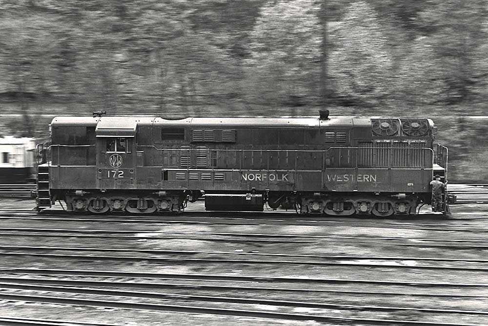 Pan shot of locomotive in yard