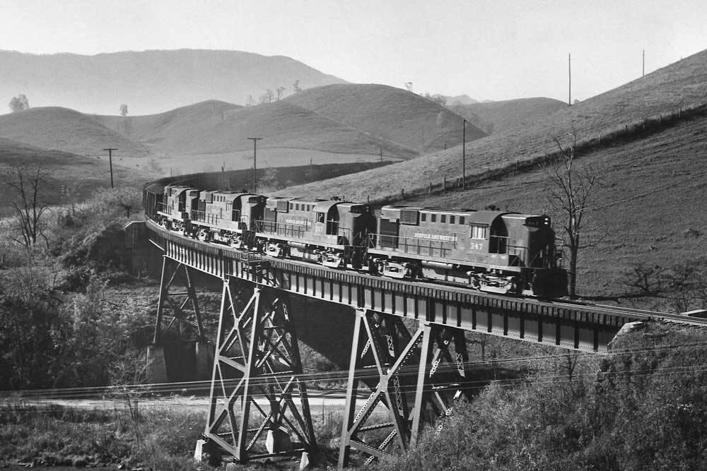 Diesel locomotives with coal train on steel viaduct