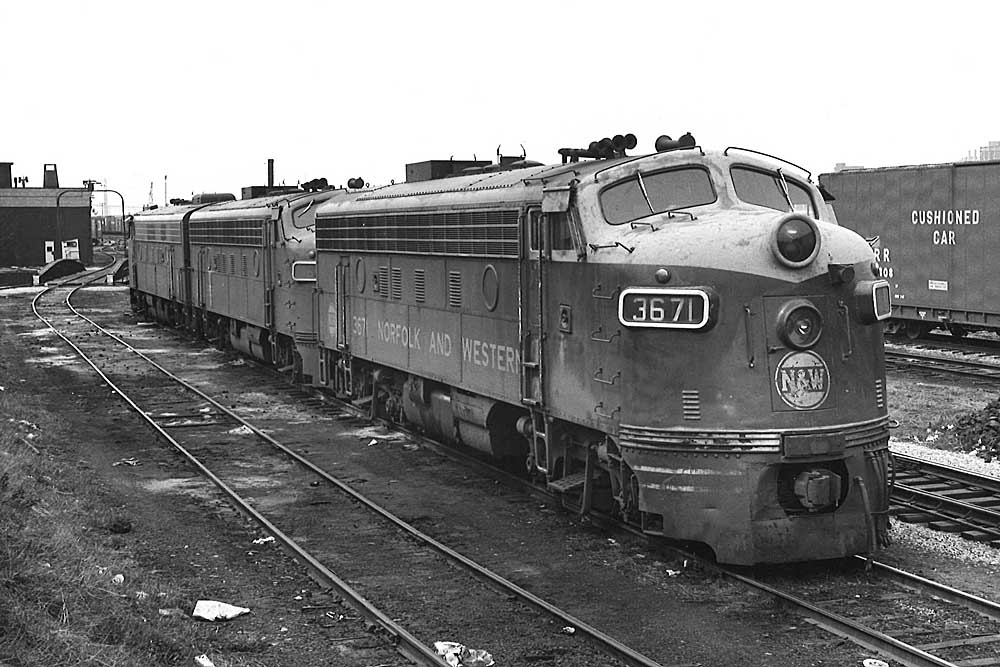 Streamlined diesel locomotives lined up in yard