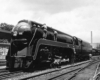 Men polishing streamlined steam locomotive