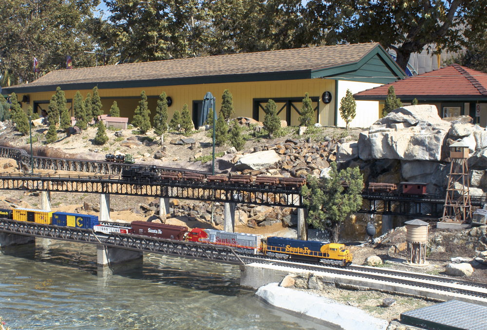 A model locomotive crossing a bridge