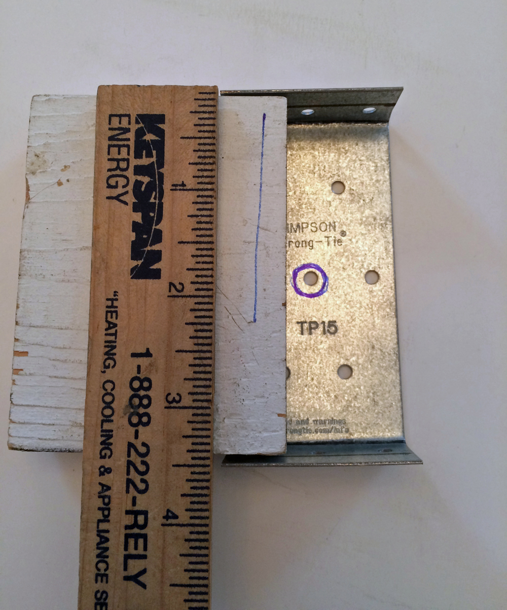 Tie clamp with ruler and block of wood