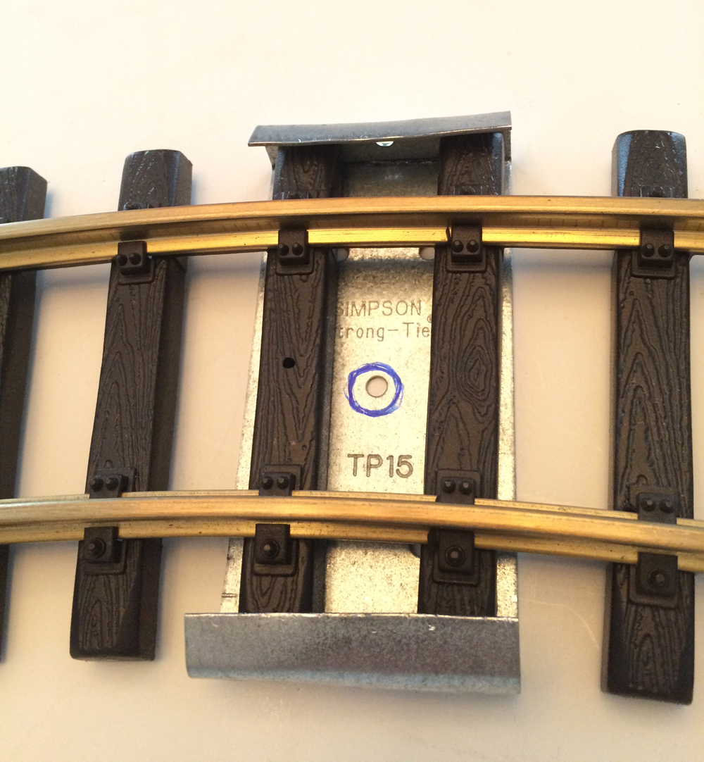 Clamp under a piece of track