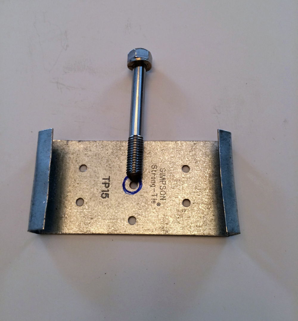 Tie plate with bolt tool